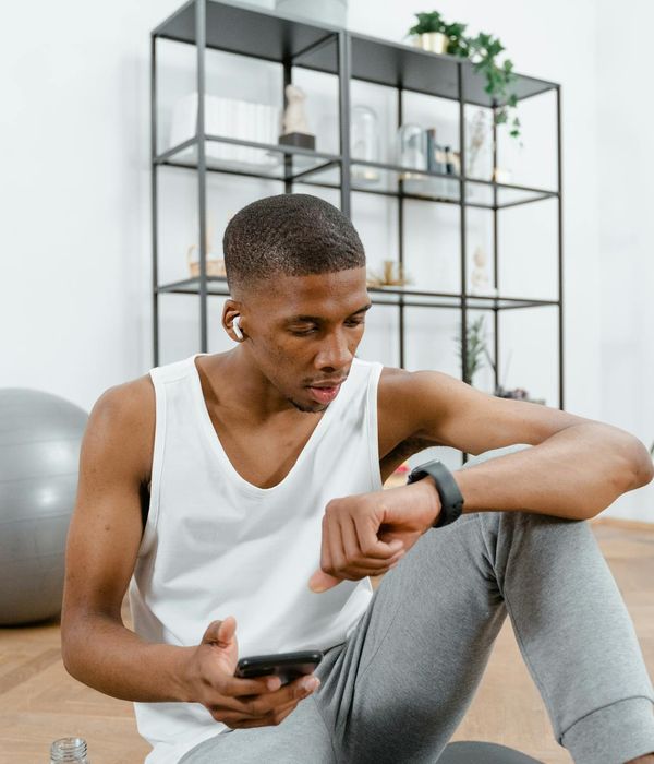 Man feeling energized and balanced after a workout session, looking confident.